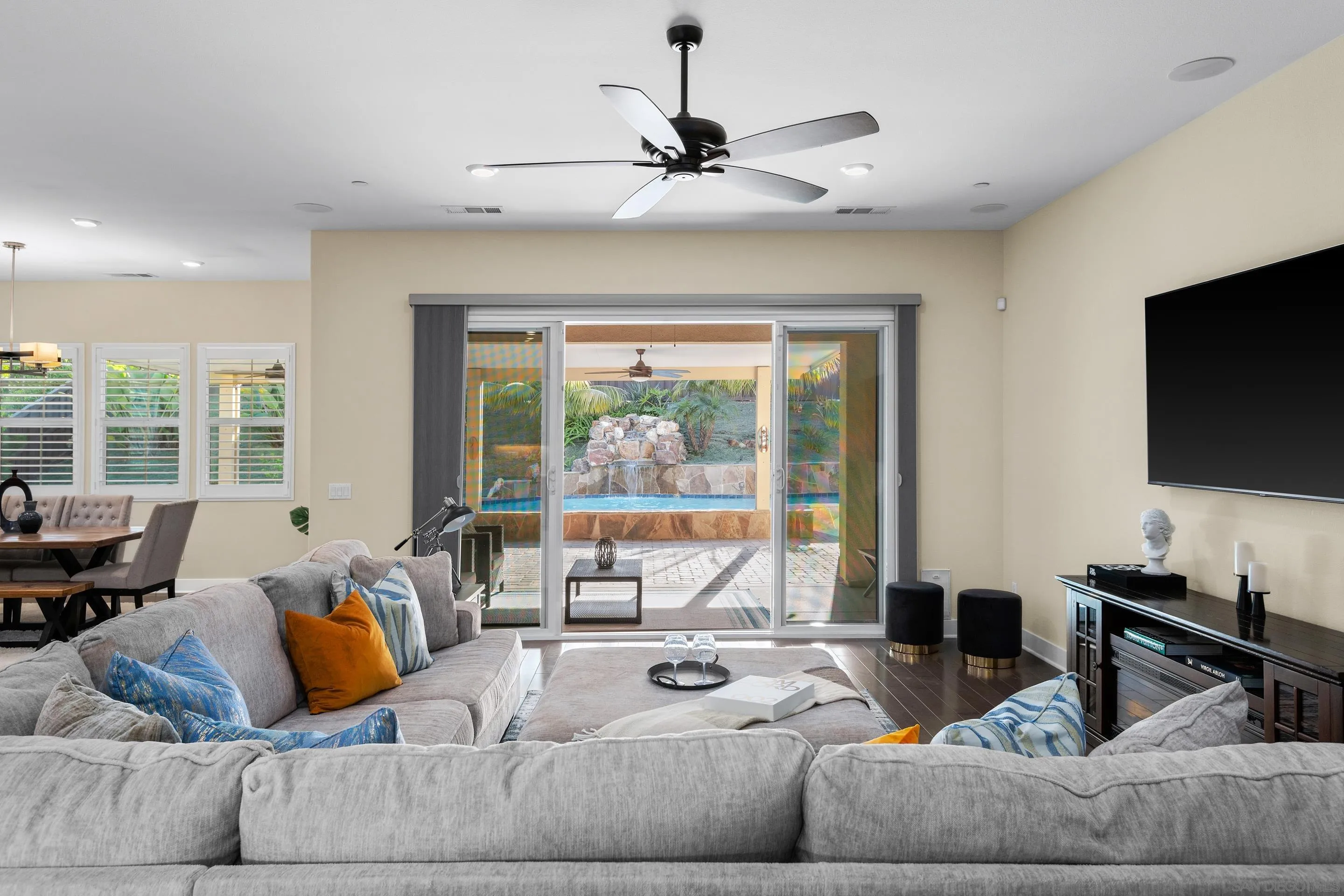 5401 Reef Circle Carlsbad, CA 92008 - Photo 7 of 45 a living room with furniture and a flat screen tv