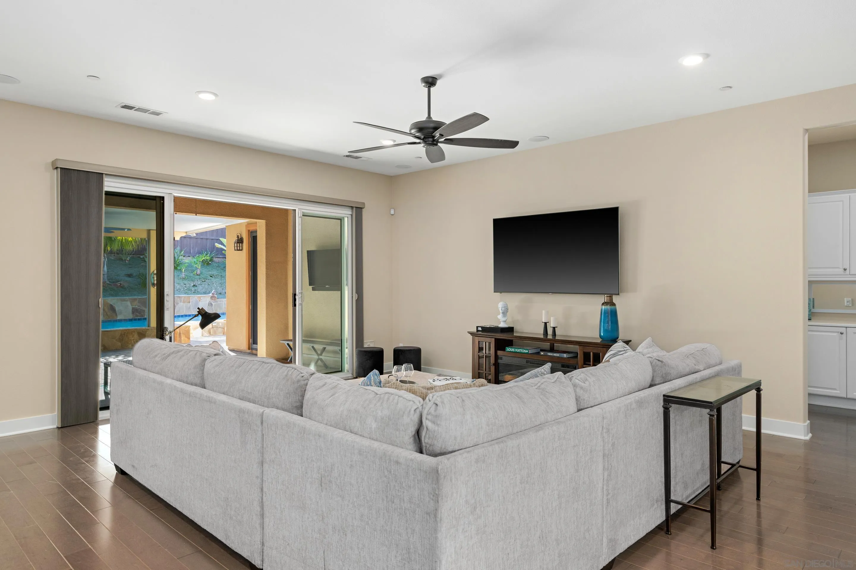 5401 Reef Circle Carlsbad, CA 92008 - Photo 9 of 45 a living room with furniture and a flat screen tv