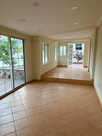 a view of a house with a yard and garage
