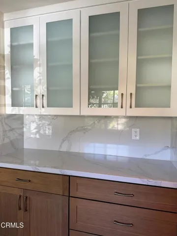 a utility room with dryer washer and a window