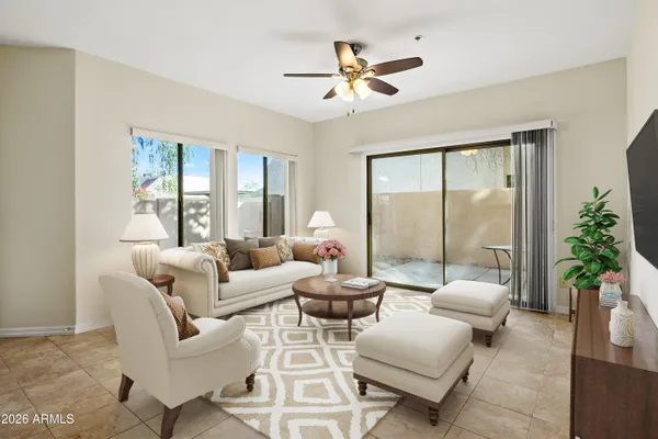 a living room with furniture and a large window