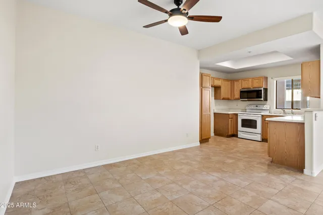 a view of a kitchen with a sink and dishwasher a stove top oven