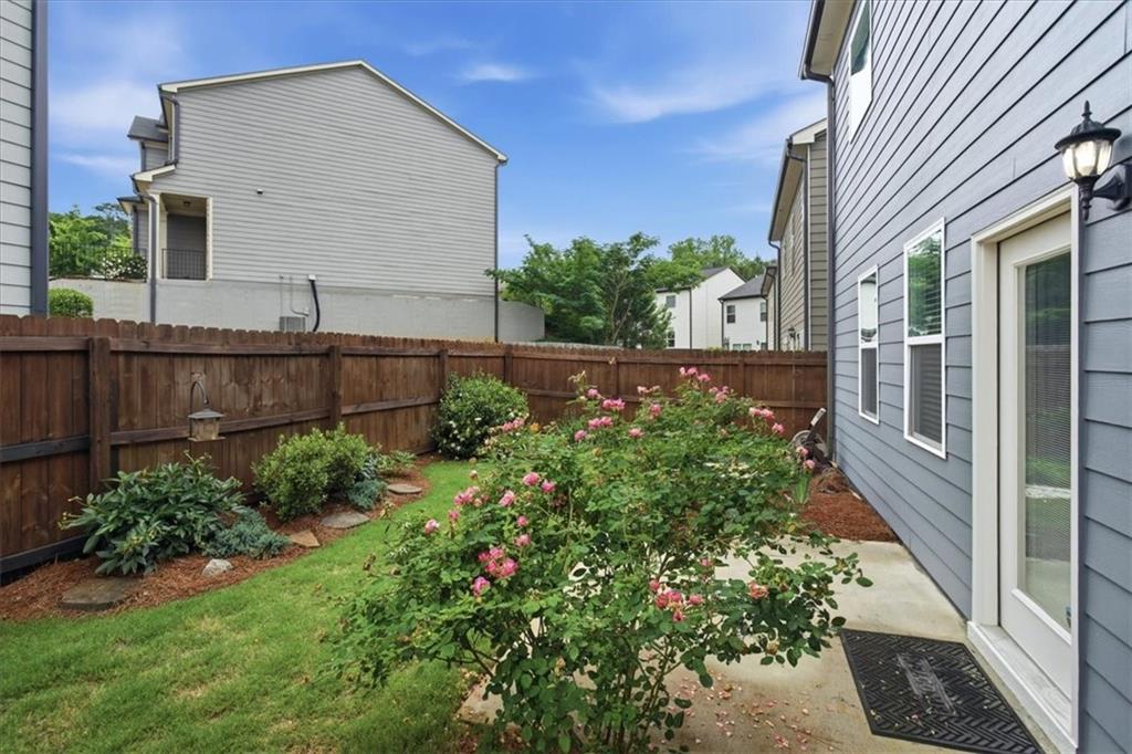 585 Summit Point Canton, GA 30114 - Photo 29 of 30 a view of a backyard with potted plants