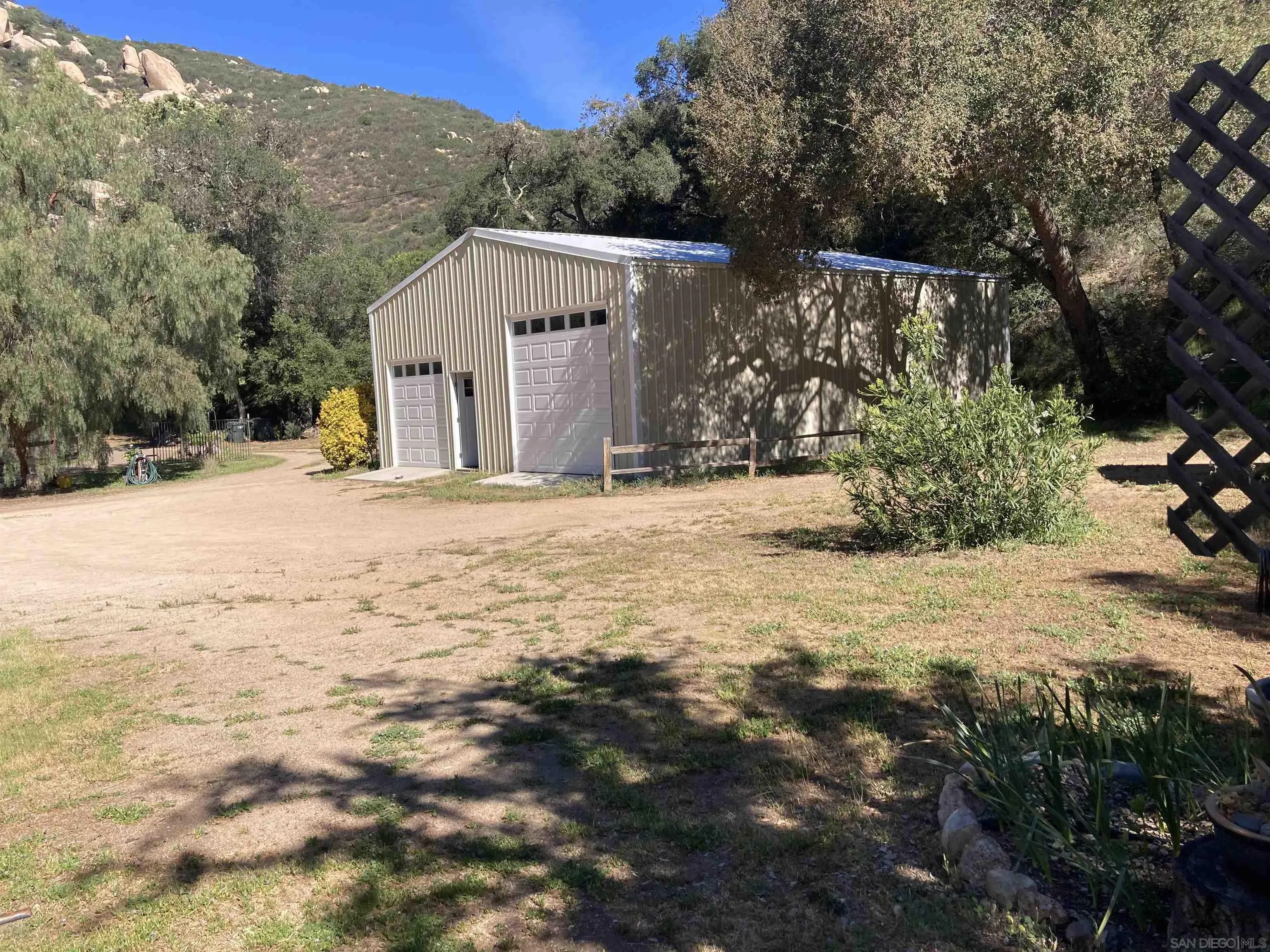 2275 Honey Springs Road Jamul, CA 91935 - Photo 11 of 17 a view of a house with a snow covered by side of it