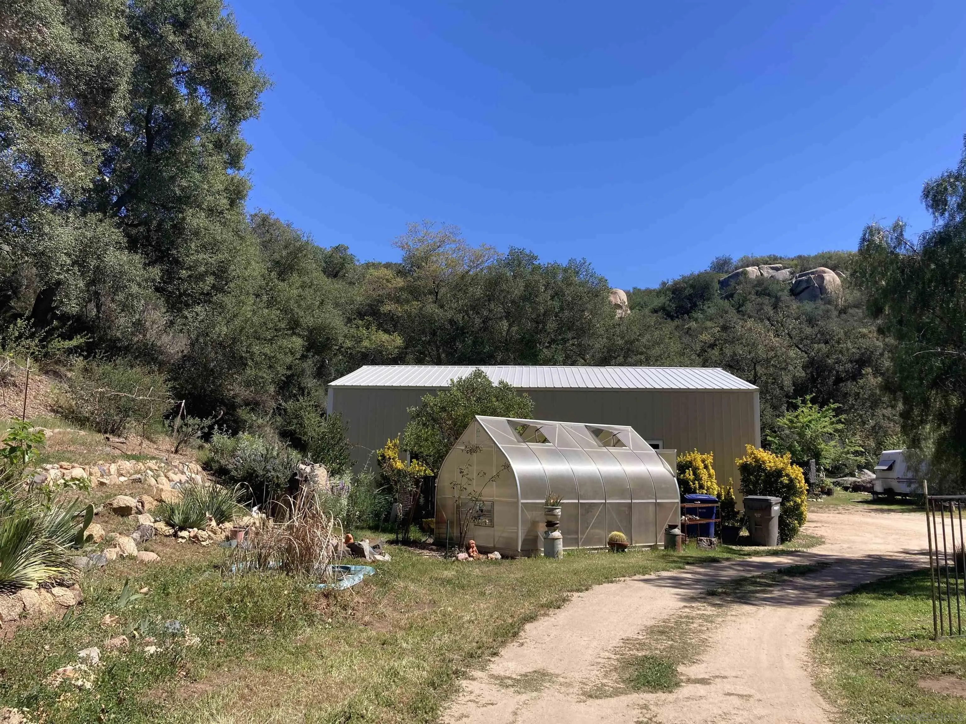 2275 Honey Springs Road Jamul, CA 91935 - Photo 13 of 17 a view of a house with yard and sitting area