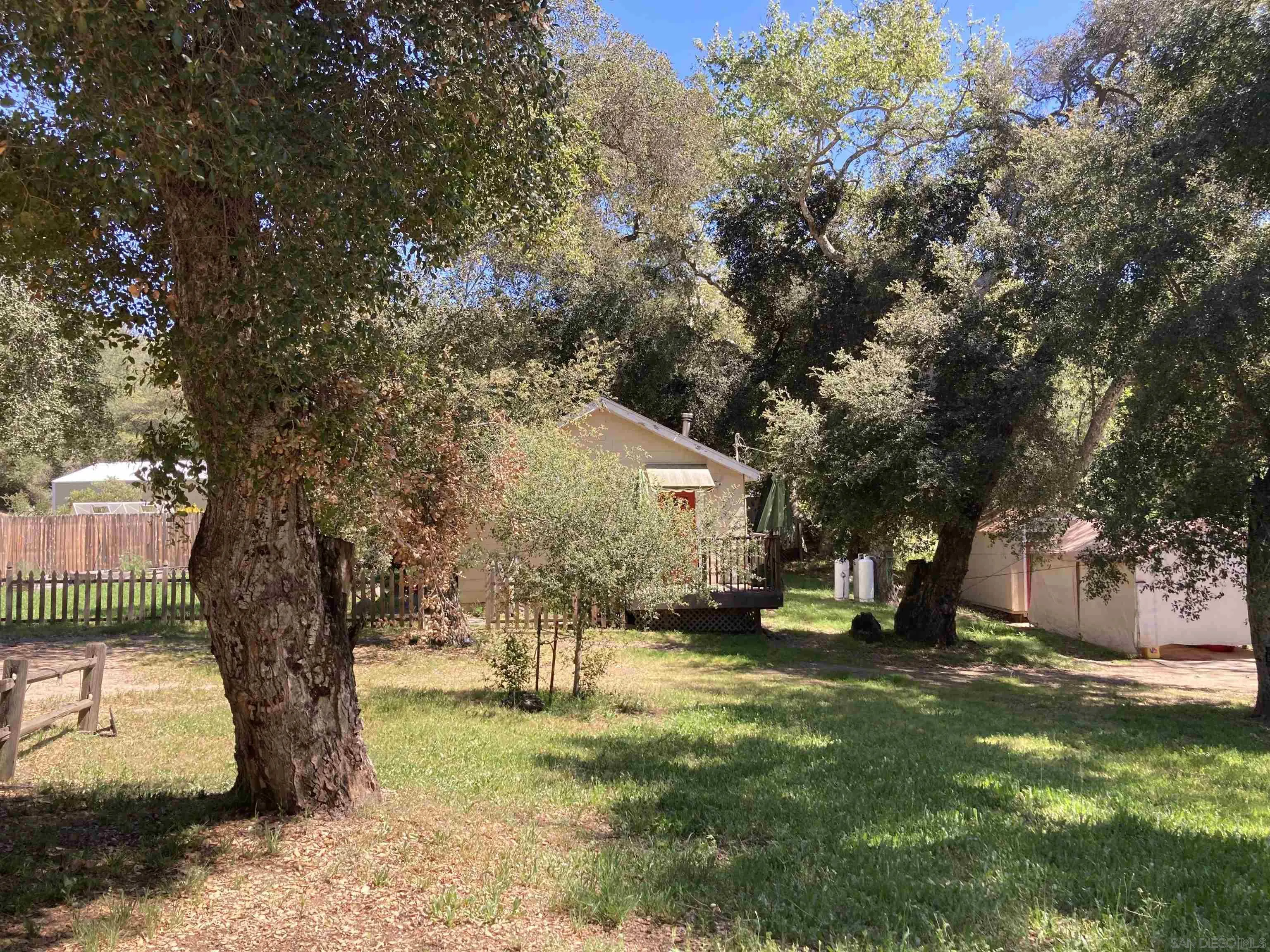 2275 Honey Springs Road Jamul, CA 91935 - Photo 14 of 17 a view of a yard with a tree