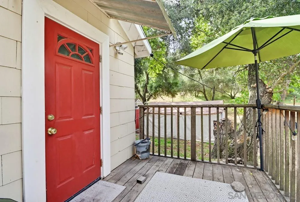 2275 Honey Springs Road Jamul, CA 91935 - Photo 3 of 17 a view of a wooden door and a yard