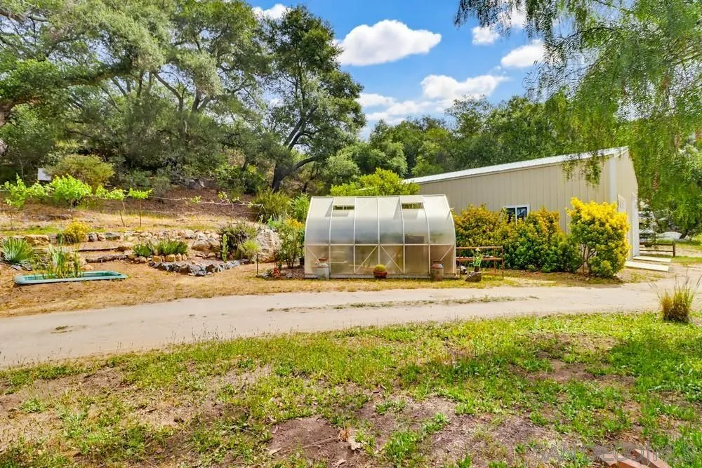 2275 Honey Springs Road Jamul, CA 91935 - Photo 8 of 17 a view of a yard and front view of a house