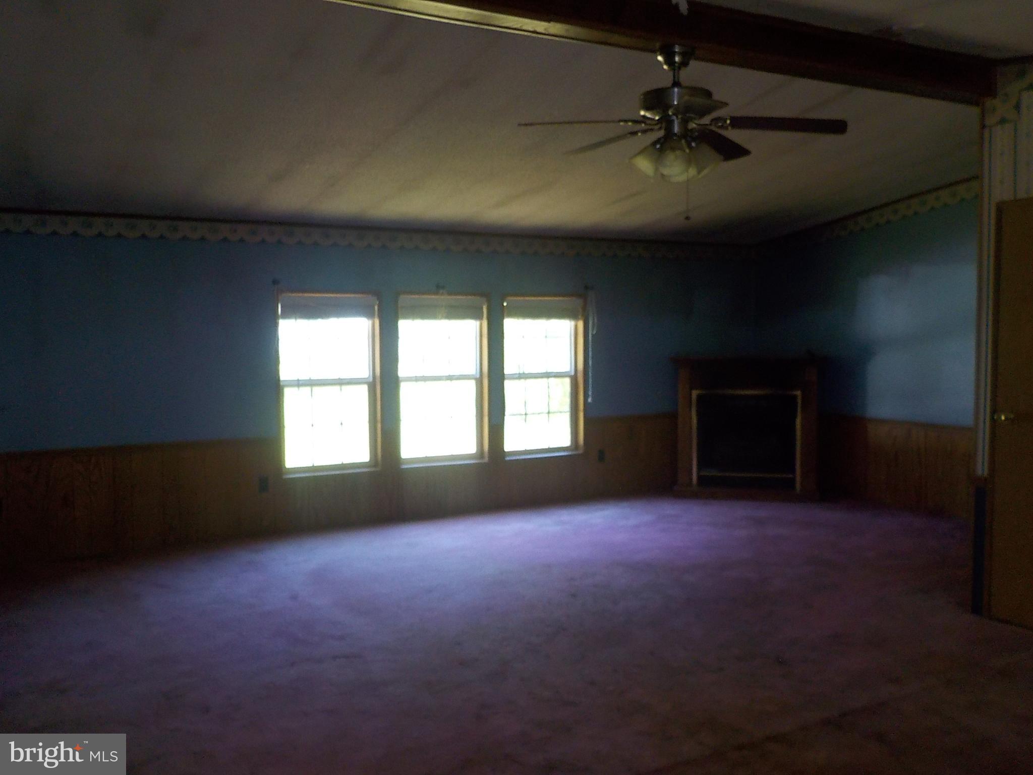 2240 Elliott Island Road Vienna, MD 21869 - Photo 6 of 26 Living room with corner gas firepalce