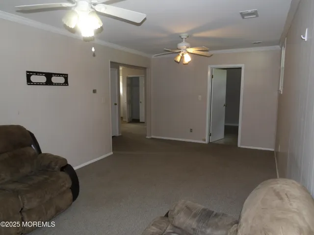 a bathroom with a sink a window and a mirror