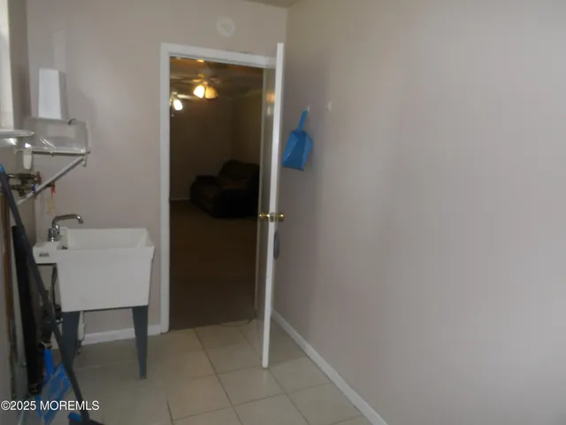 a white toilet sitting next to a bathroom sink