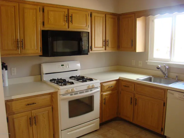 a kitchen with a stove and a microwave