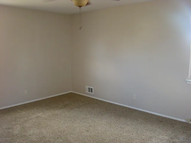 a view of balcony with wooden floor and outdoor seating