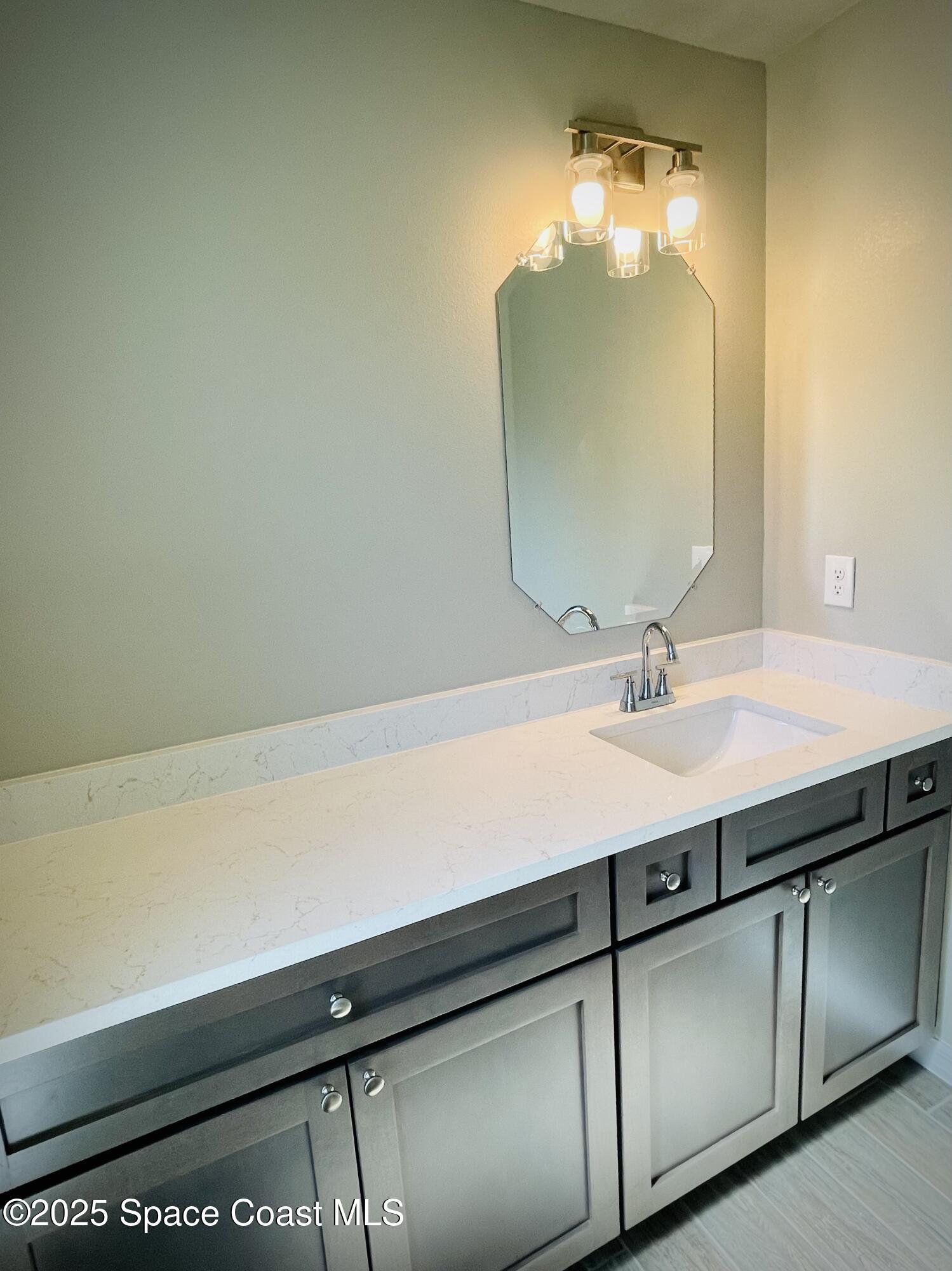 334 Frederick Street Southwest Palm Bay, FL 32908 - Photo 21 of 39 a sink with a mirror