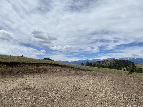 a view of a lake with mountain in the back