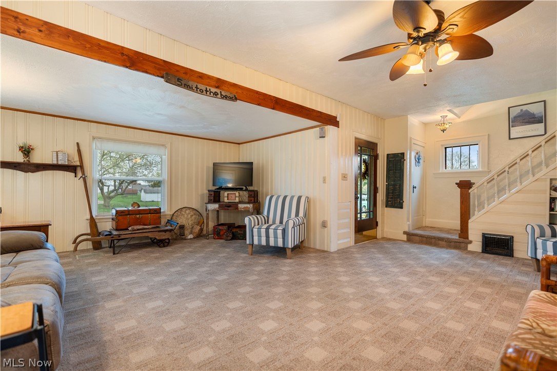 120 34th Street Southwest Canton, OH 44706 - Photo 6 of 30 Living room featuring ceiling fan and carpet flooring