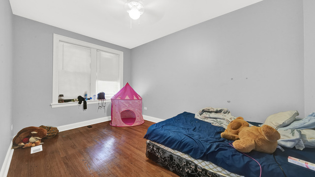 2913 West 63rd Street Chicago, IL 60629 - Photo 14 of 23 a living room with furniture and wooden floor