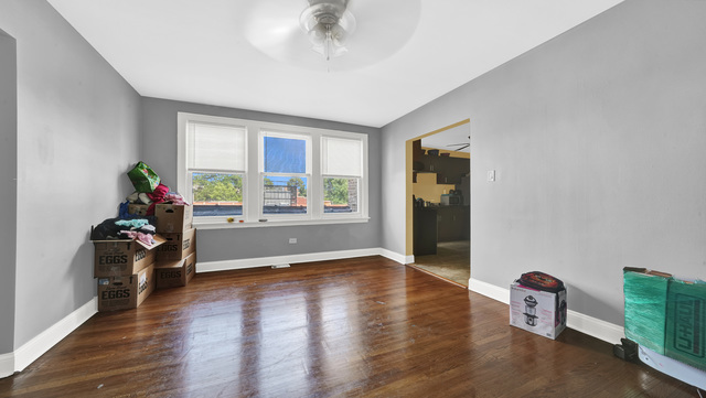 2913 West 63rd Street Chicago, IL 60629 - Photo 16 of 23 wooden floor in an empty room with a window