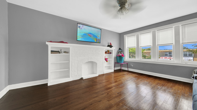 2913 West 63rd Street Chicago, IL 60629 - Photo 17 of 23 a view of an empty room with a window and wooden floor