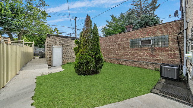 2913 West 63rd Street Chicago, IL 60629 - Photo 22 of 23 a backyard of a house with lots of green space