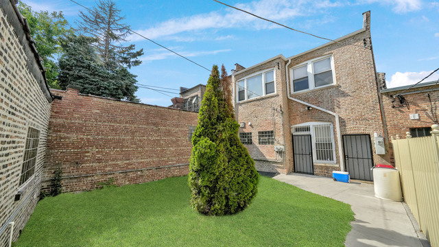 2913 West 63rd Street Chicago, IL 60629 - Photo 23 of 23 a view of a brick house with a yard