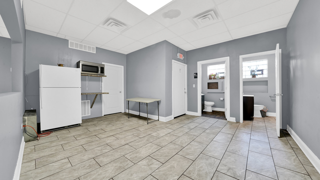 2913 West 63rd Street Chicago, IL 60629 - Photo 7 of 23 a view of a kitchen with refrigerator and more cabinets