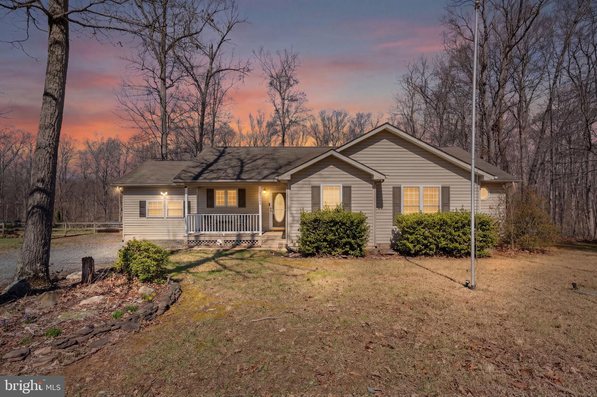 28485 Morel Way Rhoadesville, VA 22542 - Photo 1 of 42 a front view of a house with a yard