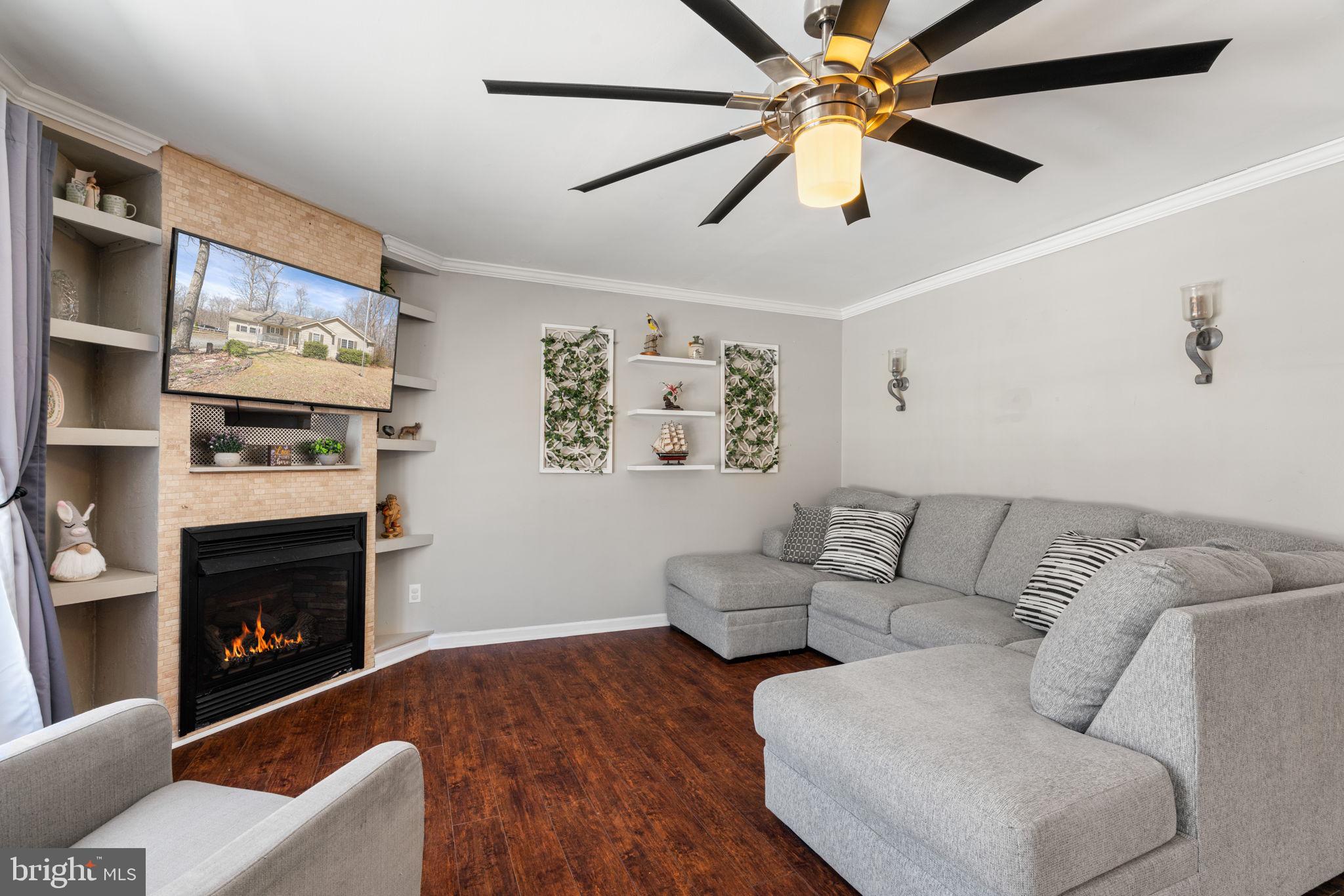 28485 Morel Way Rhoadesville, VA 22542 - Photo 20 of 42 a living room with furniture and a fireplace