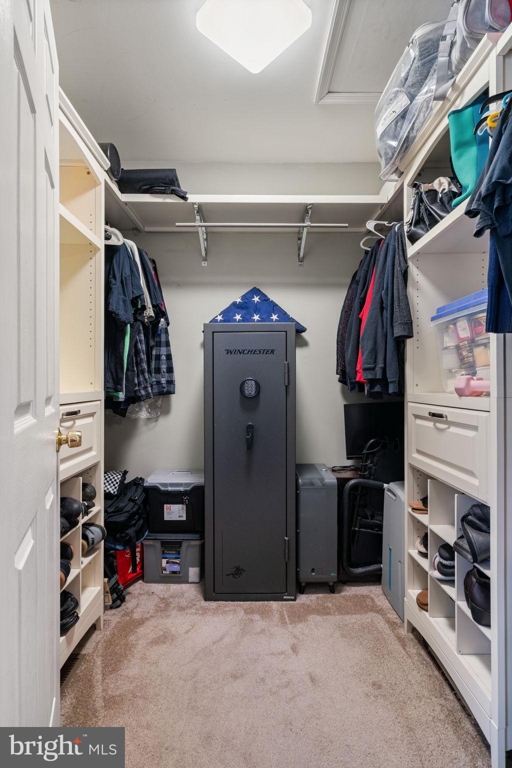 28485 Morel Way Rhoadesville, VA 22542 - Photo 24 of 42 a view of walk in closet with clothes and shoes