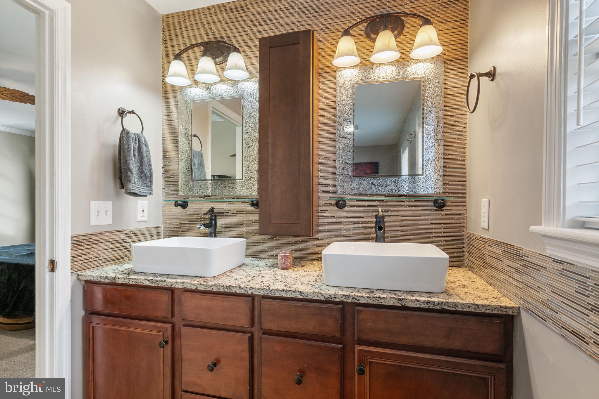 28485 Morel Way Rhoadesville, VA 22542 - Photo 27 of 42 a bathroom with a sink and a mirror