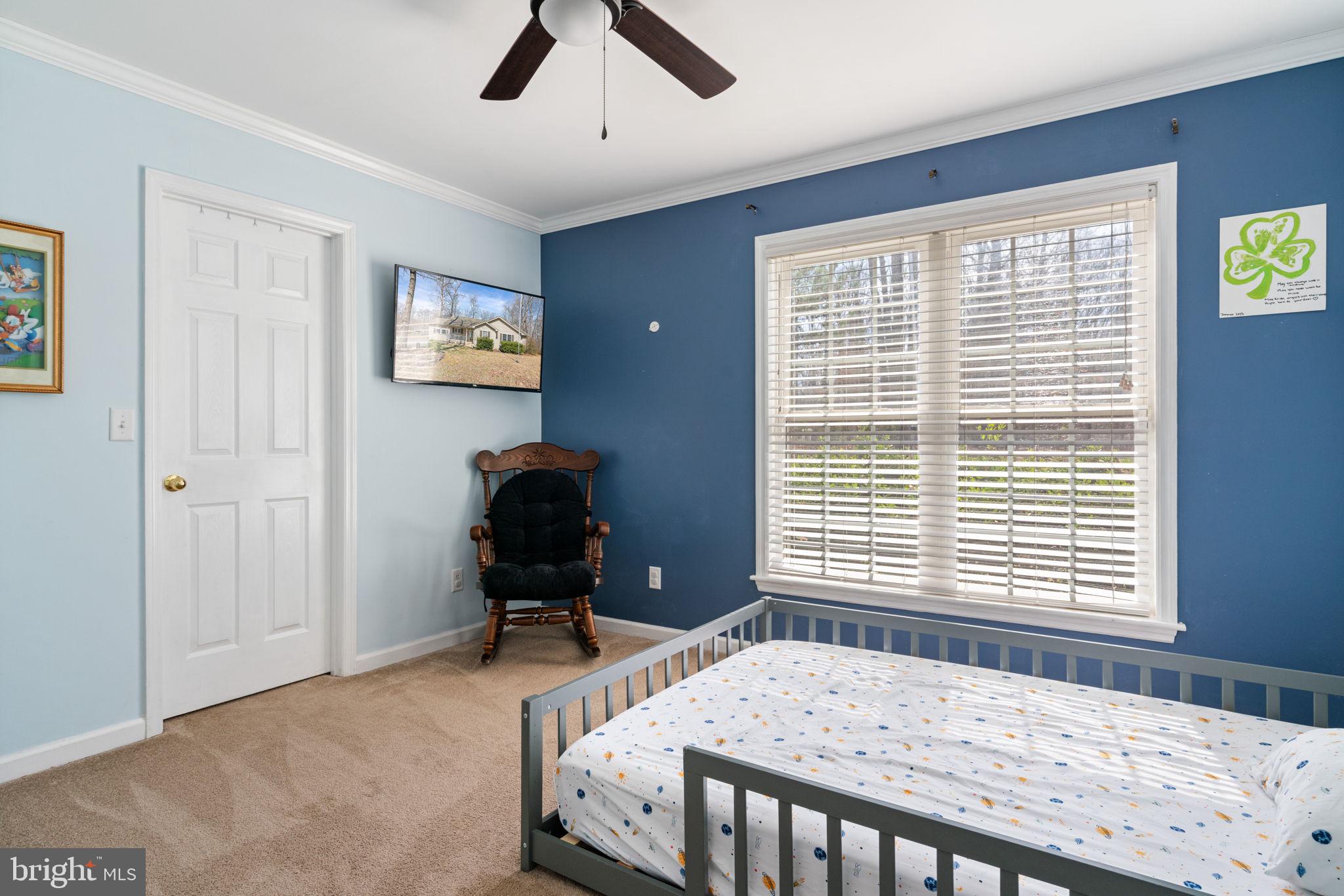 28485 Morel Way Rhoadesville, VA 22542 - Photo 29 of 42 a bedroom with a bed and a window
