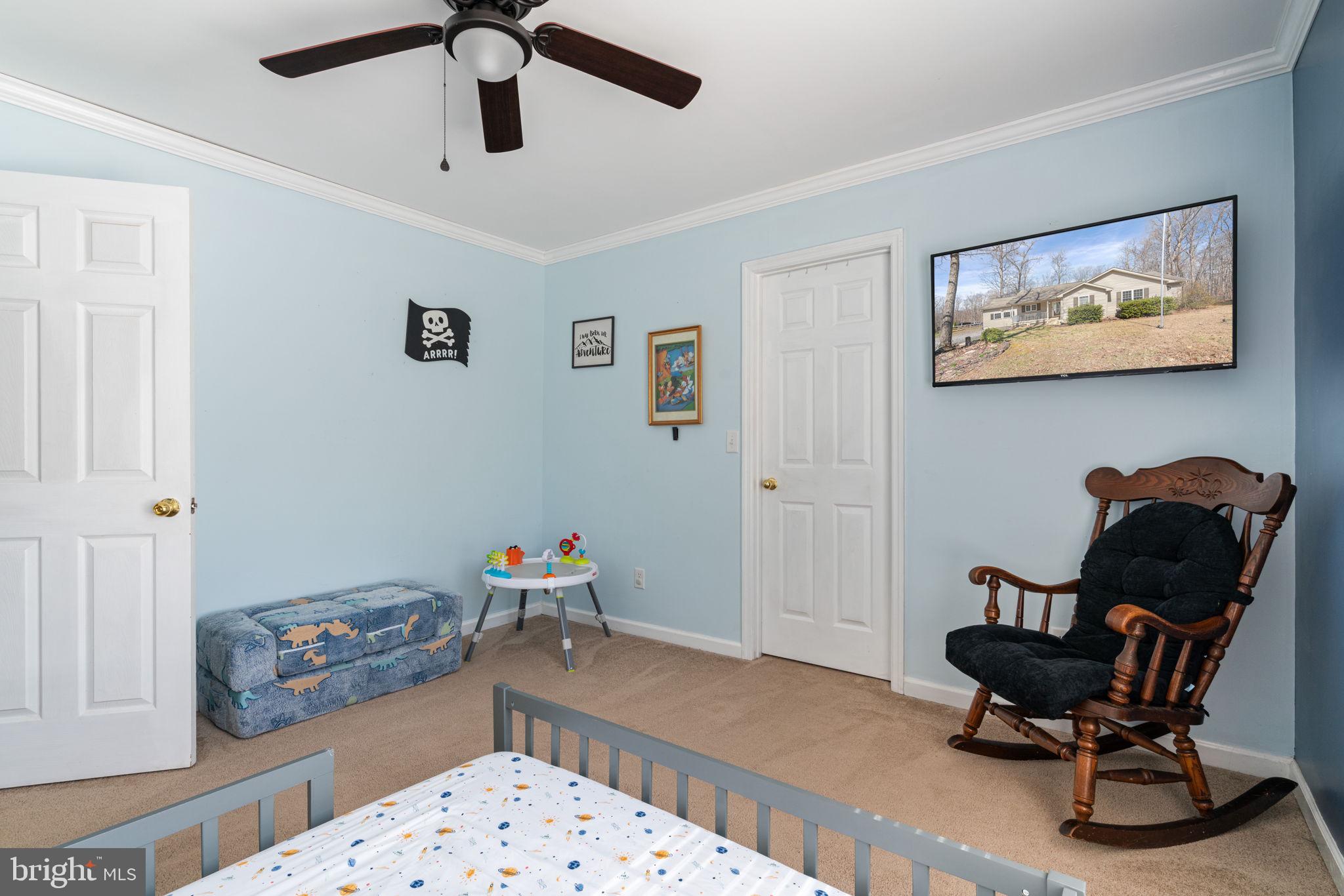 28485 Morel Way Rhoadesville, VA 22542 - Photo 30 of 42 a bedroom with furniture and a wooden floor