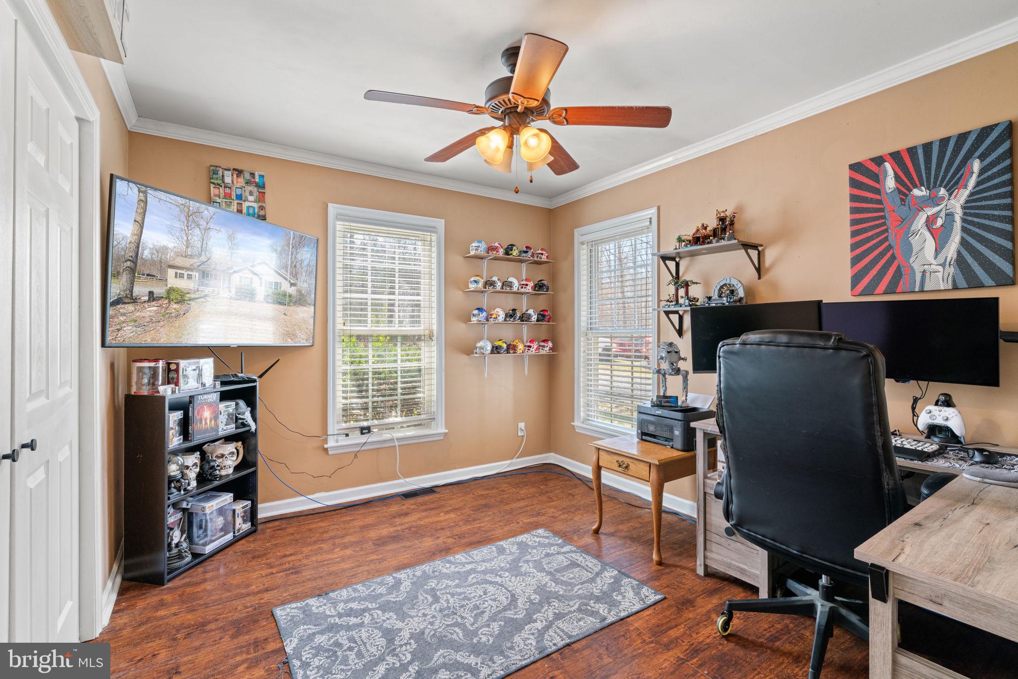 28485 Morel Way Rhoadesville, VA 22542 - Photo 32 of 42 a workspace with furniture hardwood and a window