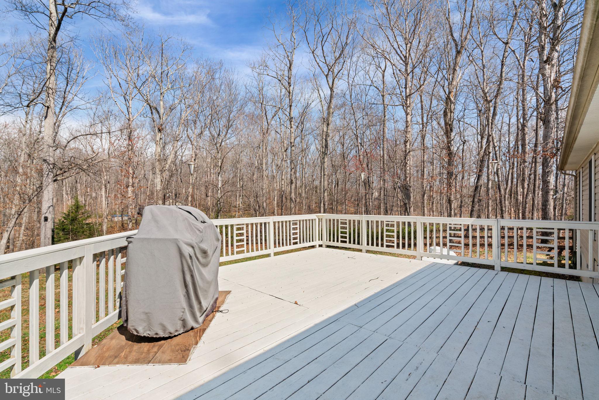 28485 Morel Way Rhoadesville, VA 22542 - Photo 36 of 42 a balcony with wooden floor and fence