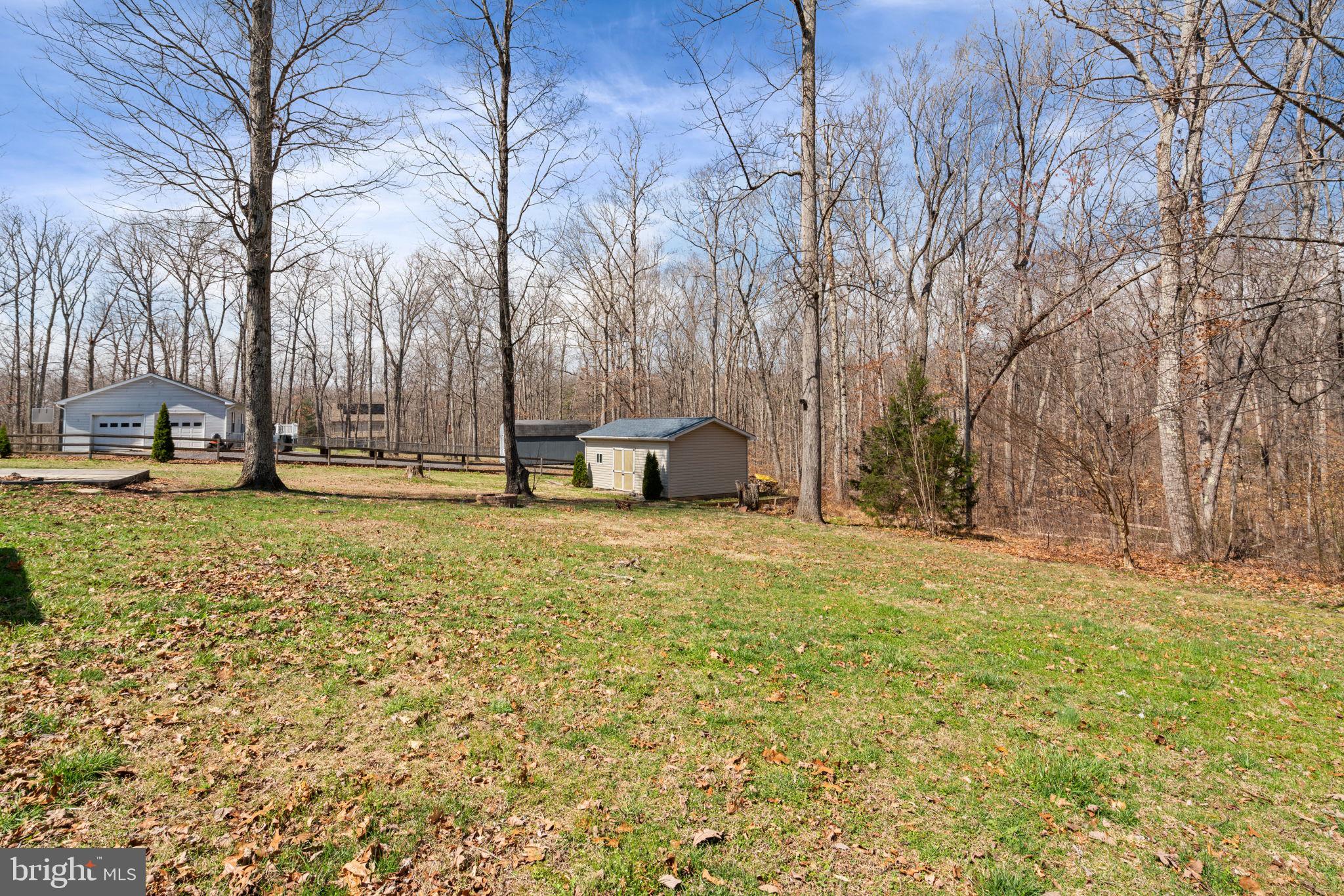 28485 Morel Way Rhoadesville, VA 22542 - Photo 39 of 42 a backyard of apartments with large trees
