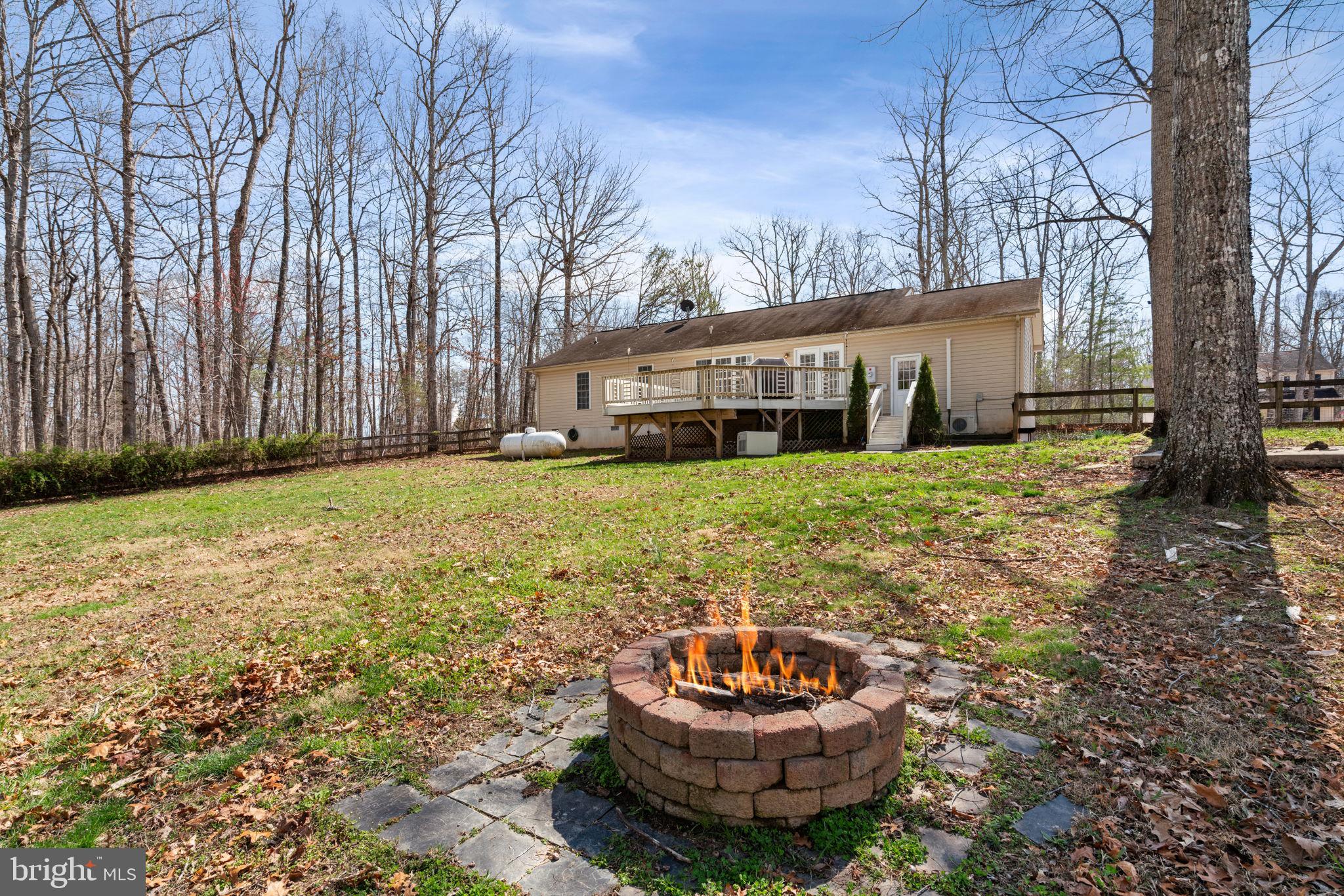 28485 Morel Way Rhoadesville, VA 22542 - Photo 41 of 42 a view of a house with a yard and sitting area