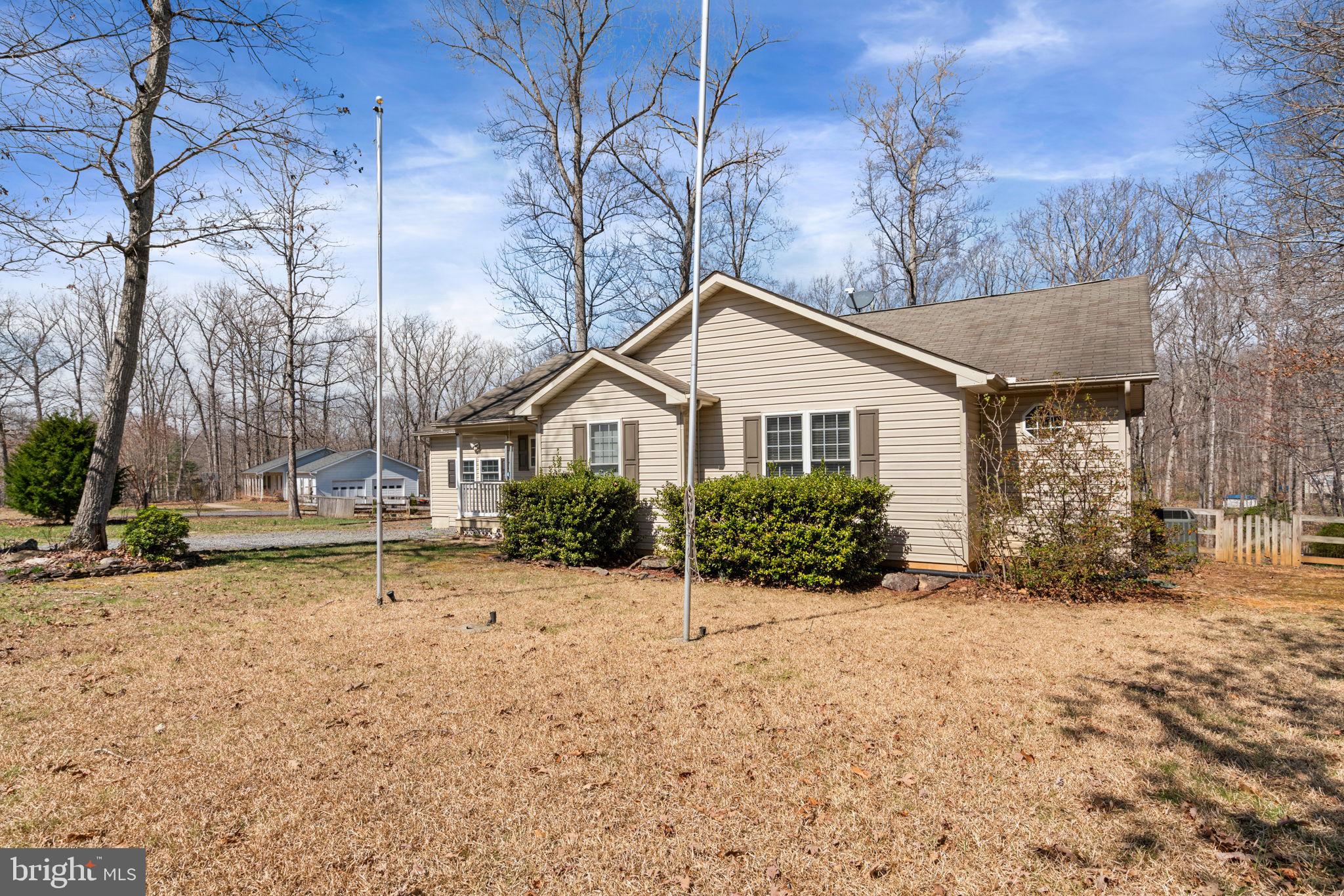 28485 Morel Way Rhoadesville, VA 22542 - Photo 5 of 42 a view of a house with a yard and pathway