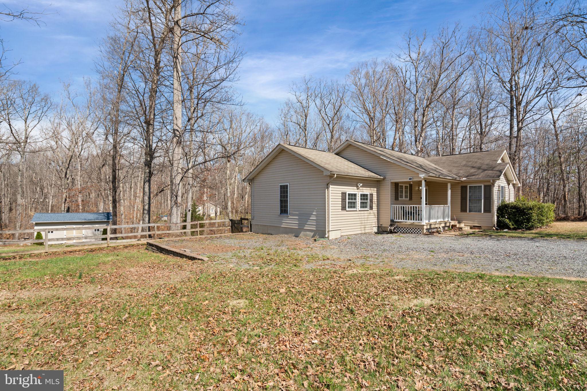 28485 Morel Way Rhoadesville, VA 22542 - Photo 6 of 42 a view of a house with a yard covered with snow in front of house