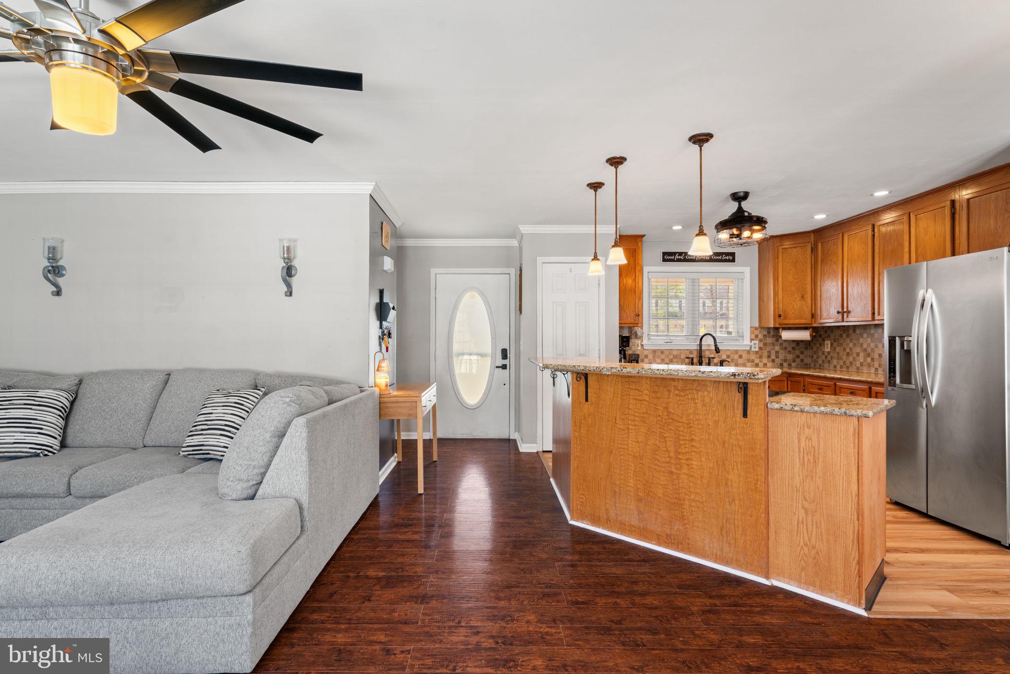 28485 Morel Way Rhoadesville, VA 22542 - Photo 7 of 42 a living room with stainless steel appliances furniture and a kitchen view