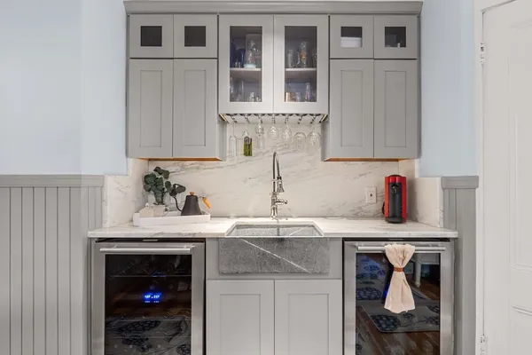 a kitchen with stainless steel appliances granite countertop a sink and cabinets