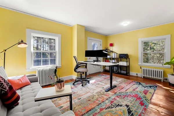 a workspace with furniture and a window