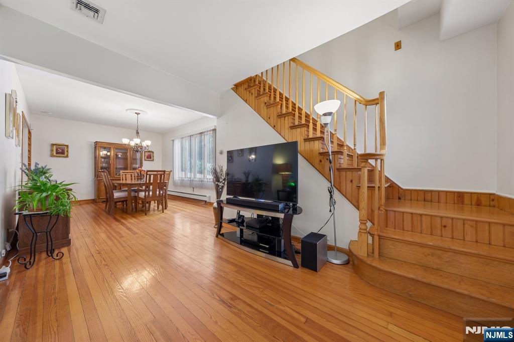 562 Valley Road Clifton, NJ 07013 - Photo 7 of 35 a living room with furniture and a flat screen tv
