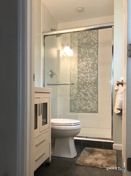 914 South Pine Creek Road, Unit A Fairfield, CT 06824 - Photo 7 of 15 a bathroom with a sink toilet and shower