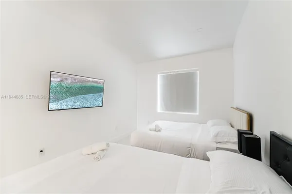 a bedroom with a bed and a table