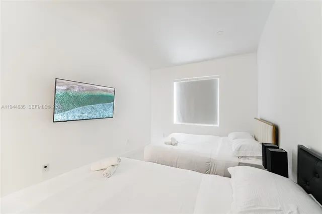 a bedroom with a bed and a table