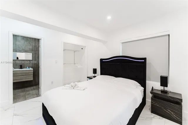 a bathroom with a sink toilet and a mirror