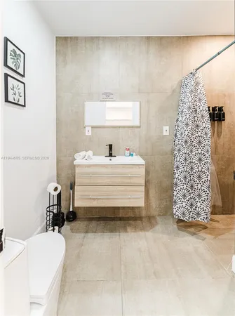 a bathroom with a shower and a window