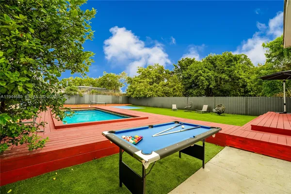a view of an outdoor space pool patio and outdoor seating