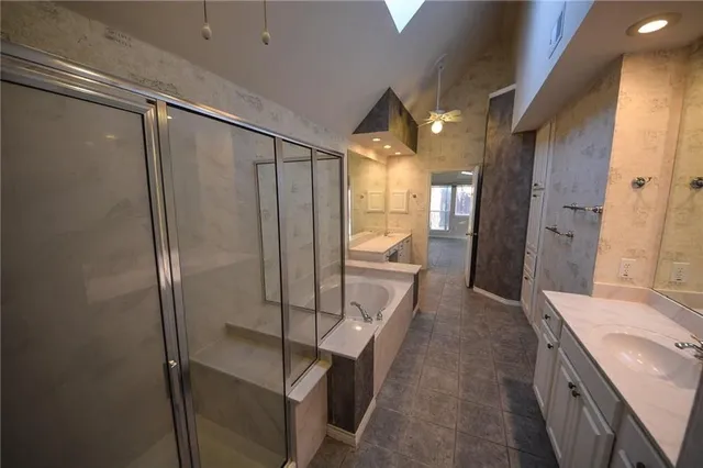 a bathroom with a shower and a sink