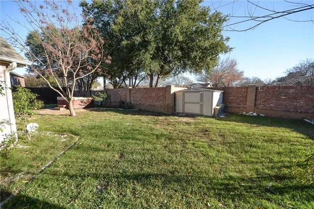 a view of a backyard with sitting area